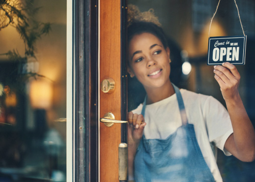 Business owner turning around open sign